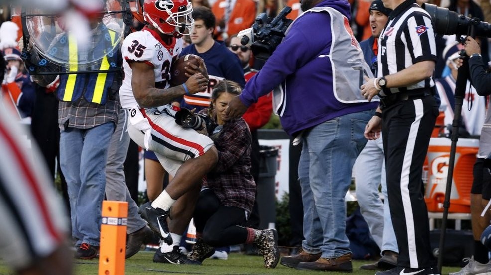Photographer releases statement after hit during Georgia-Auburn game